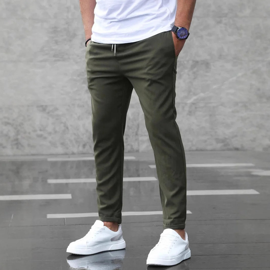 Army Green slim-fit stretch pants for men in a simple standing pose