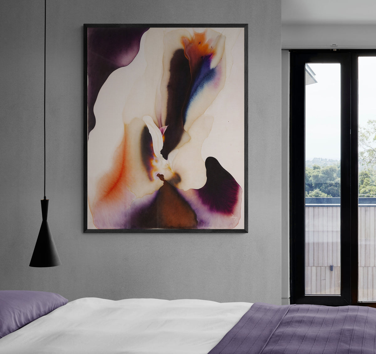 Purple and Orange Ink Bloom canvas on a gray bedroom wall beside a black pendant light