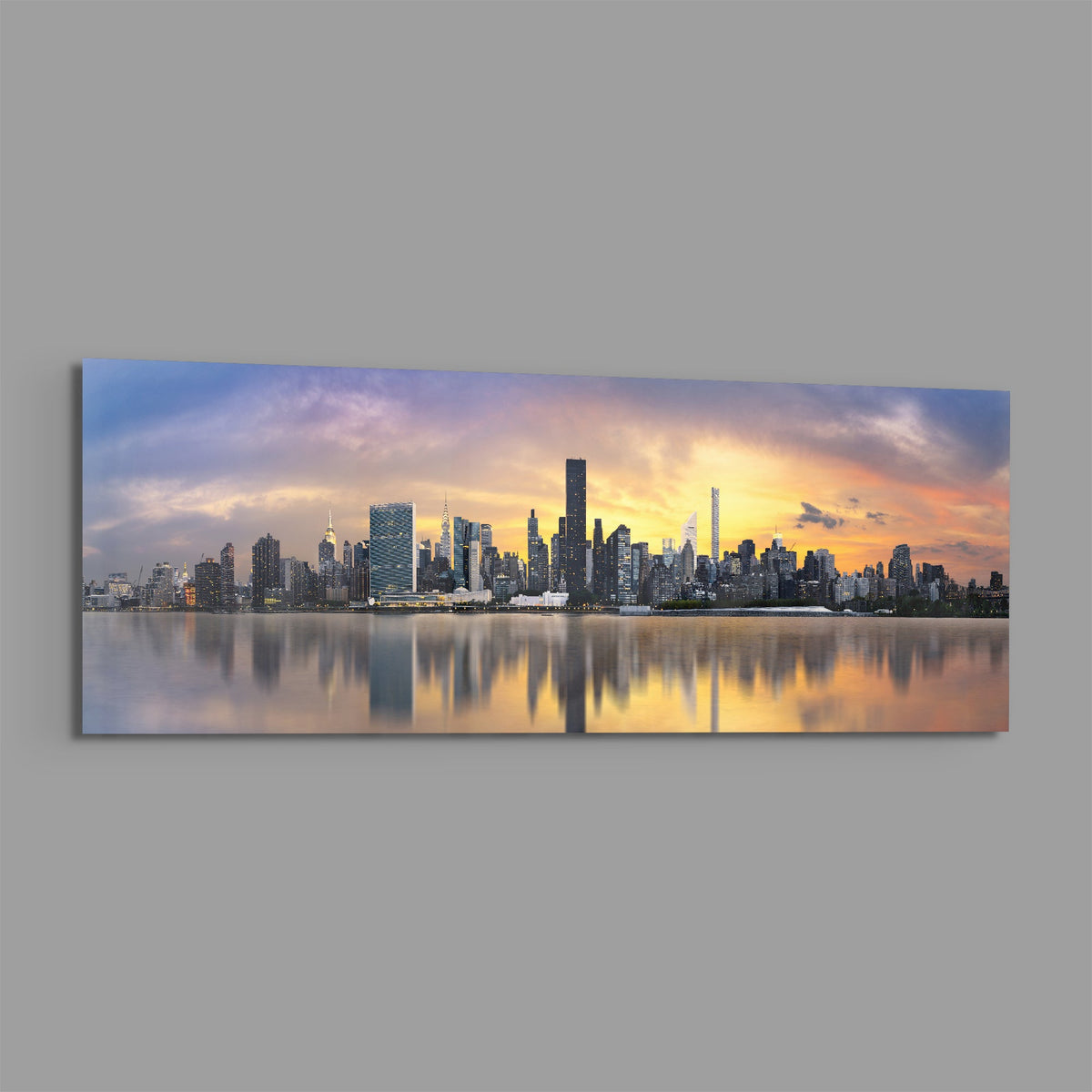 New York sunset skyline panoramic glass wall art shown at an angle on a gray background