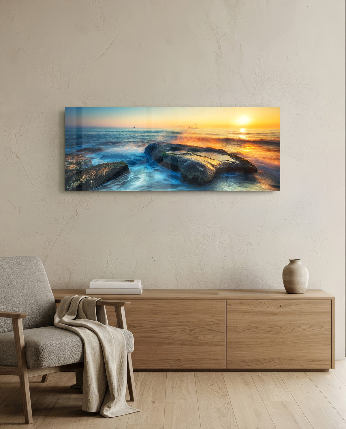 Mossy rocks sunrise sea glass wall art above a light oak sideboard beside a cream armchair