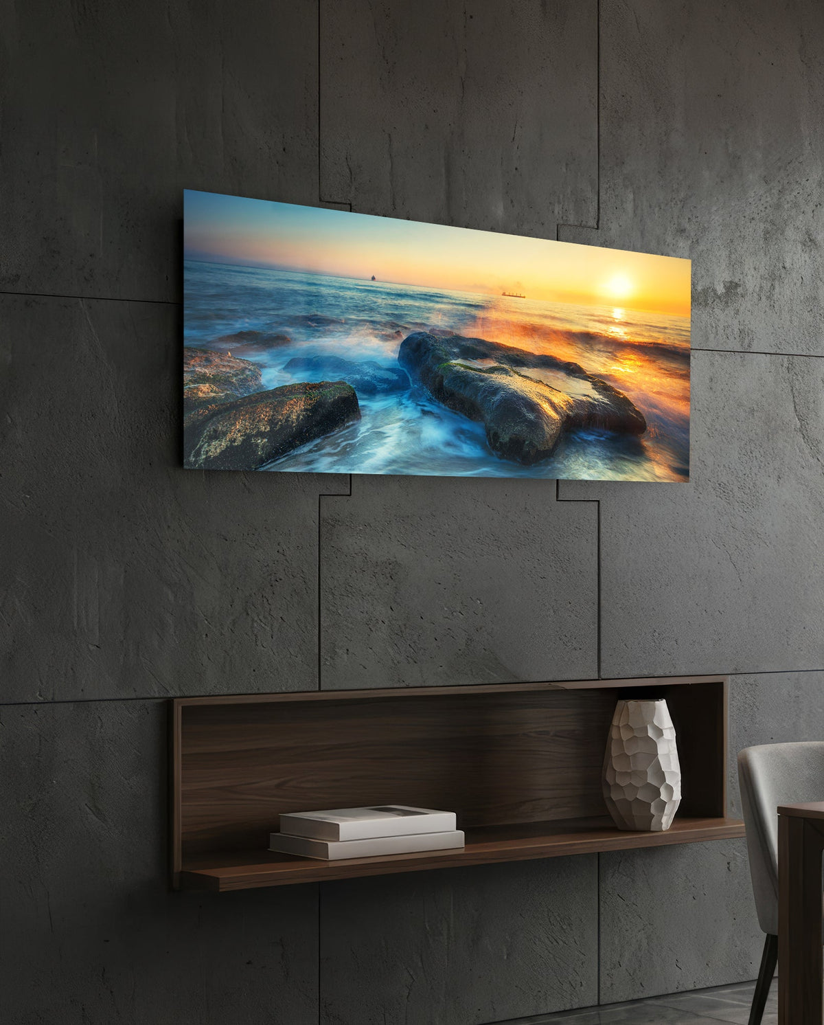 Mossy rocks sunrise sea glass wall art above a dark wood wall shelf on a charcoal paneled wall