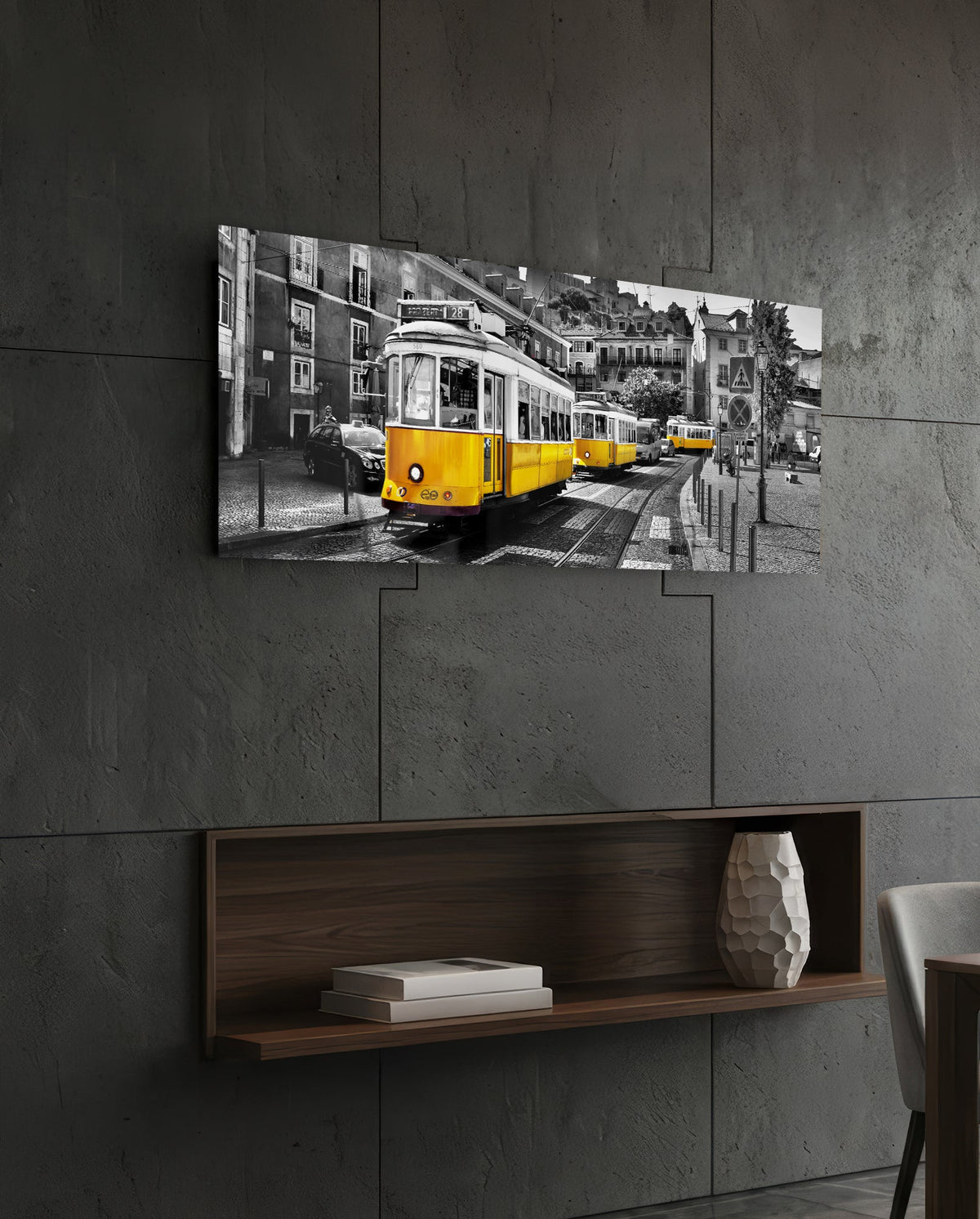 Yellow tram panoramic glass wall art on a dark stone wall above a wooden wall niche
