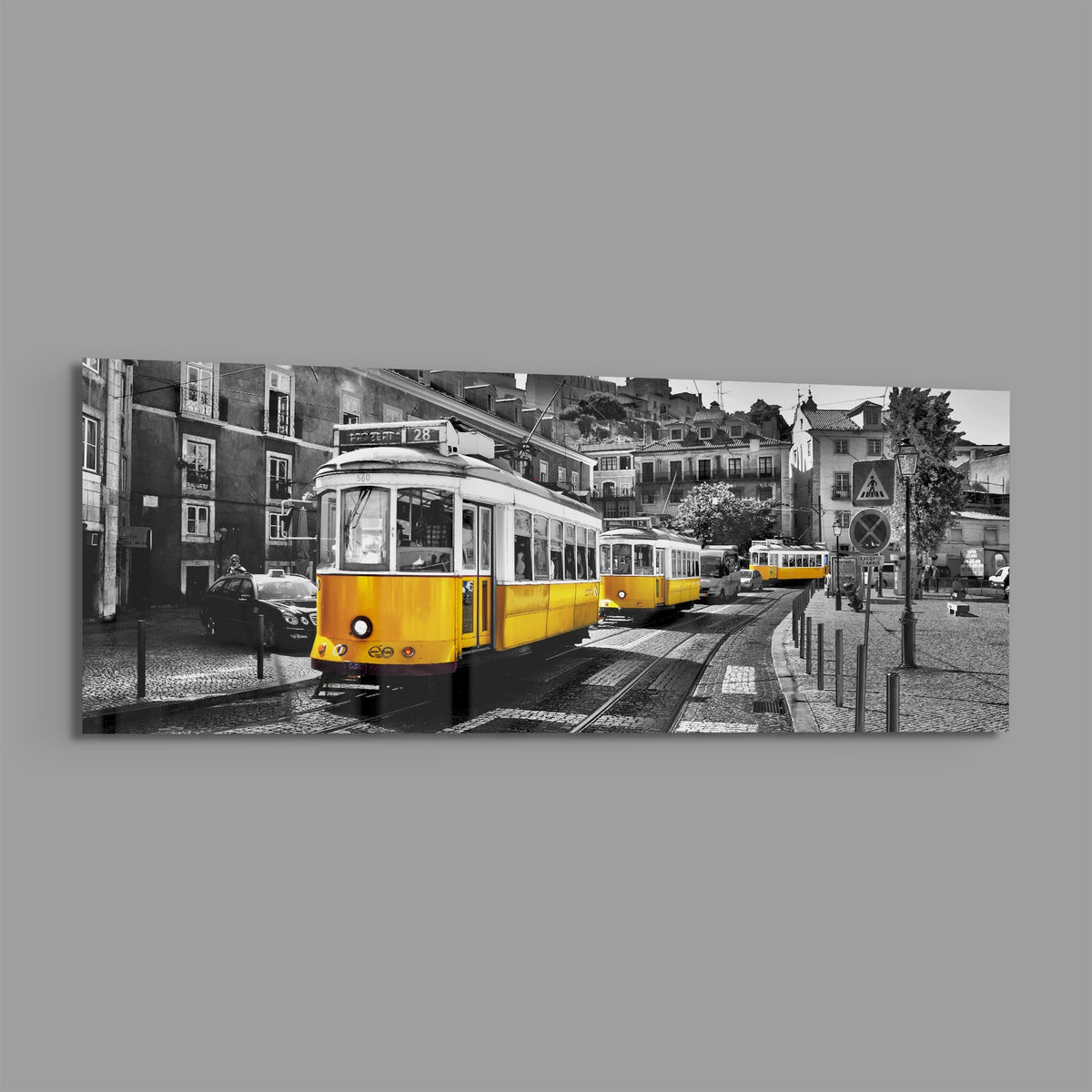 Lisbon yellow tram panoramic glass wall art on a plain gray background