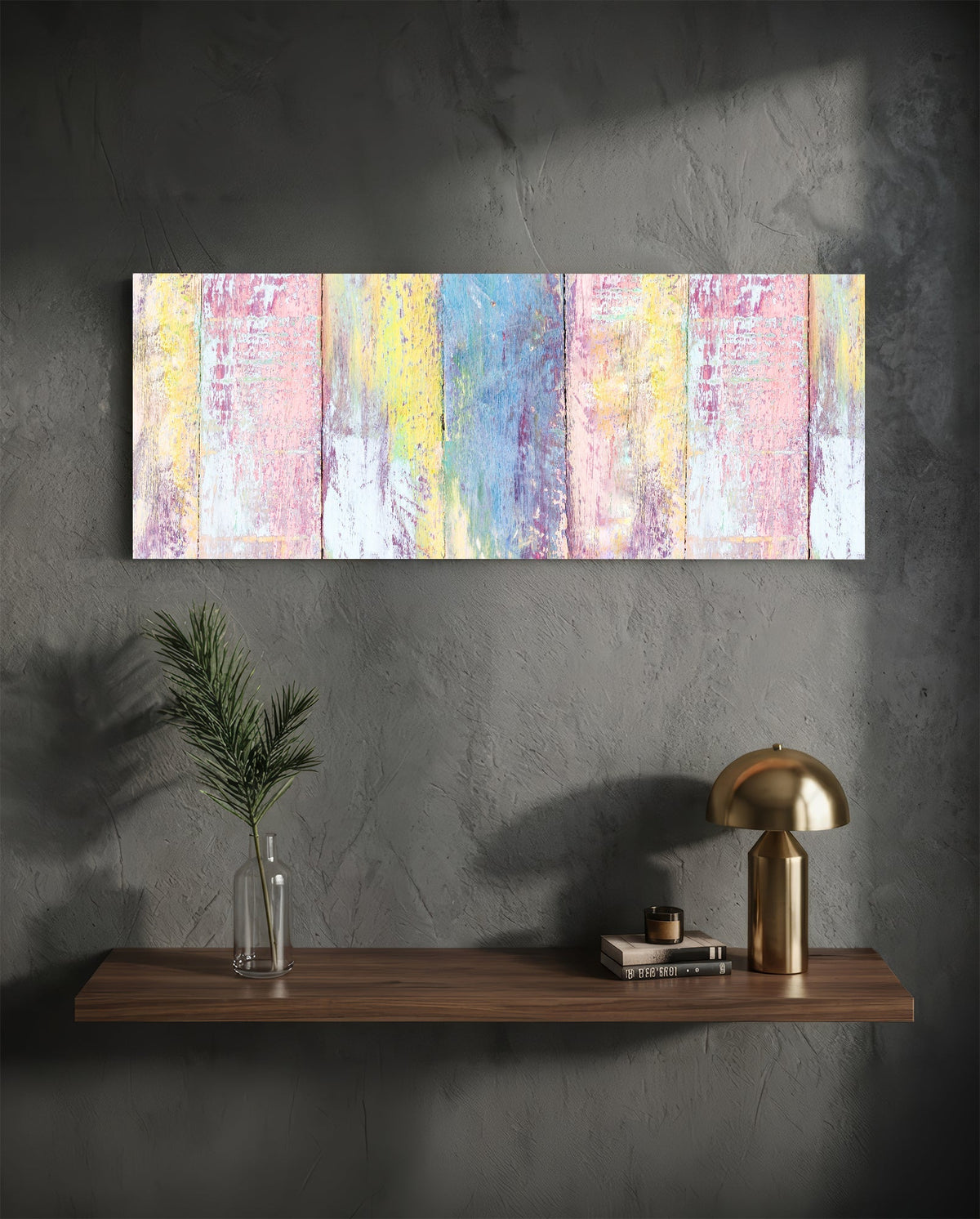 Pastel painted wood planks glass wall art on a charcoal wall above a floating shelf with a brass lamp and greenery