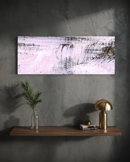 Blush pink brushstroke abstract glass wall art on a charcoal wall above a floating shelf with a brass lamp and greenery