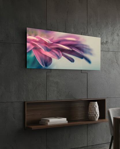 Pink flower petal macro glass wall art on a dark tiled wall above a recessed walnut shelf with a vase