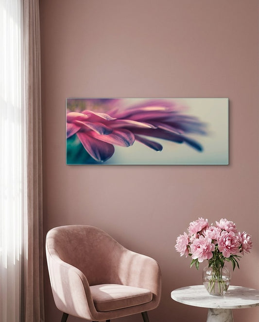 Pink flower petal macro glass wall art on a blush wall above a pink armchair and a vase of peonies