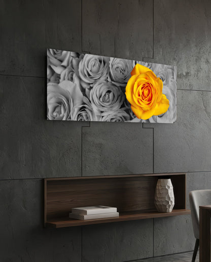 Yellow rose on gray roses glass wall art on a dark slate wall above a walnut floating shelf