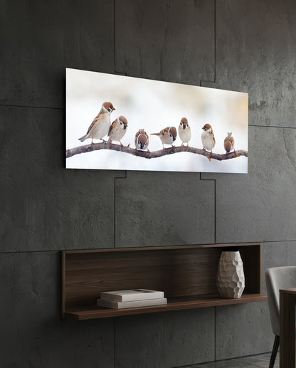 Seven sparrows glass wall art on a dark tiled wall above an open walnut shelf