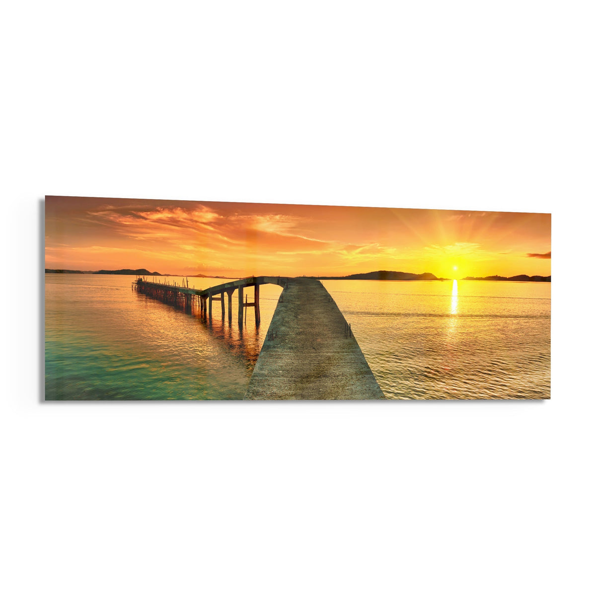 Golden sunset curved pier panoramic glass print angled on a white background
