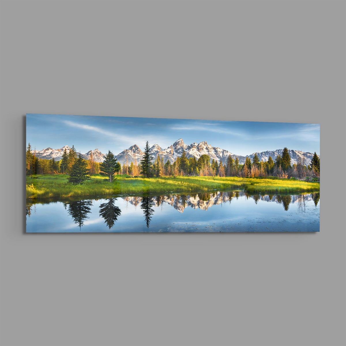 Mountain lake reflection panoramic glass piece shown on a plain gray background