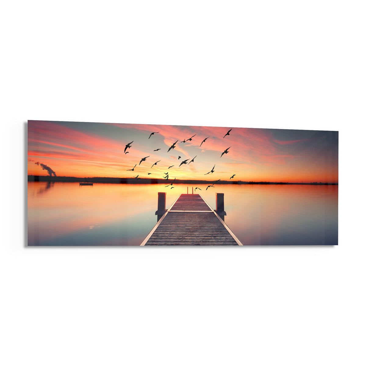 Sunset pier panoramic glass wall art on a white background, angled to show the glass
