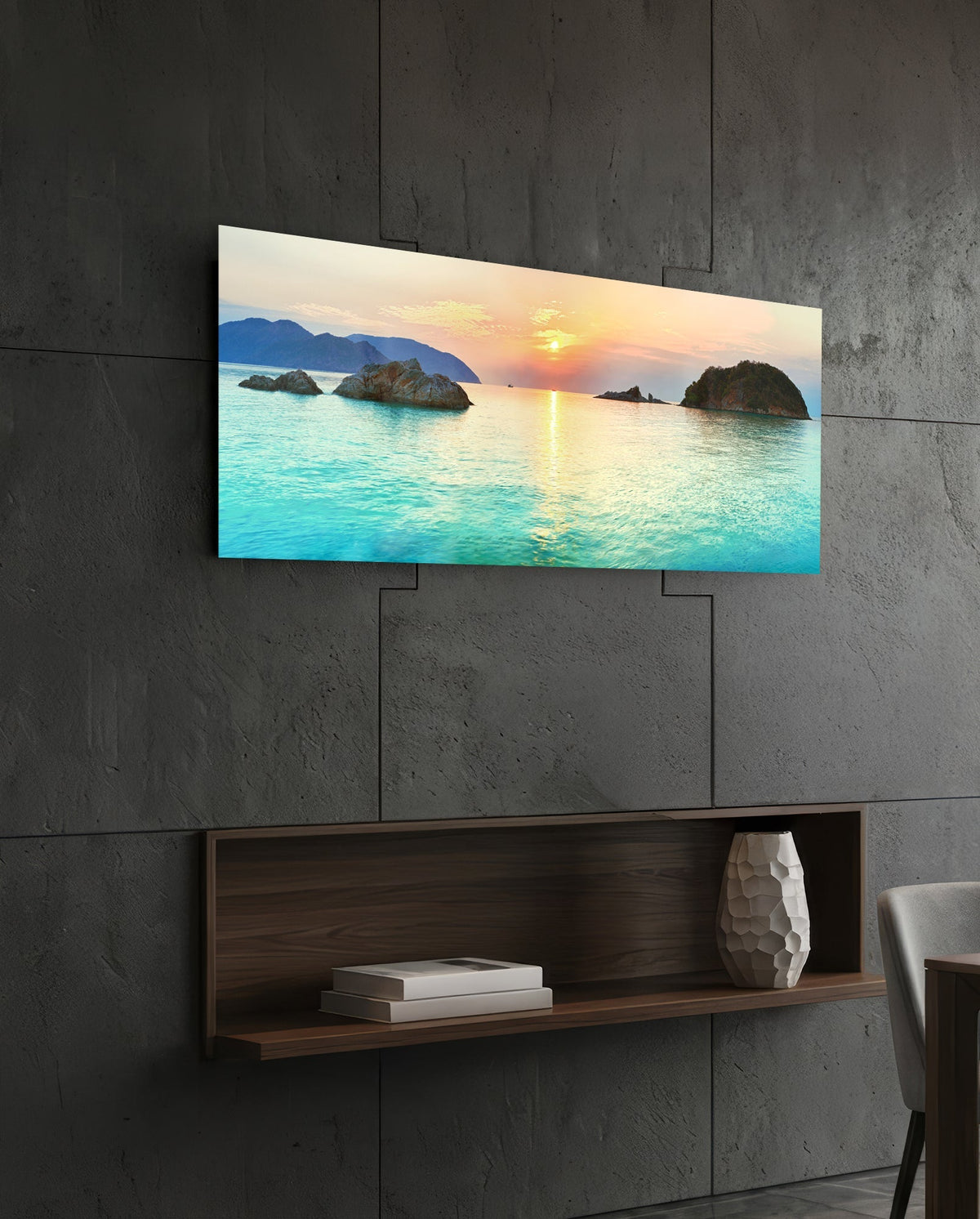 Turquoise bay islets at sunset glass wall art above a dark wood wall shelf on a charcoal paneled wall