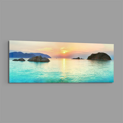 Turquoise bay islets at sunset panoramic glass print angled on a gray background