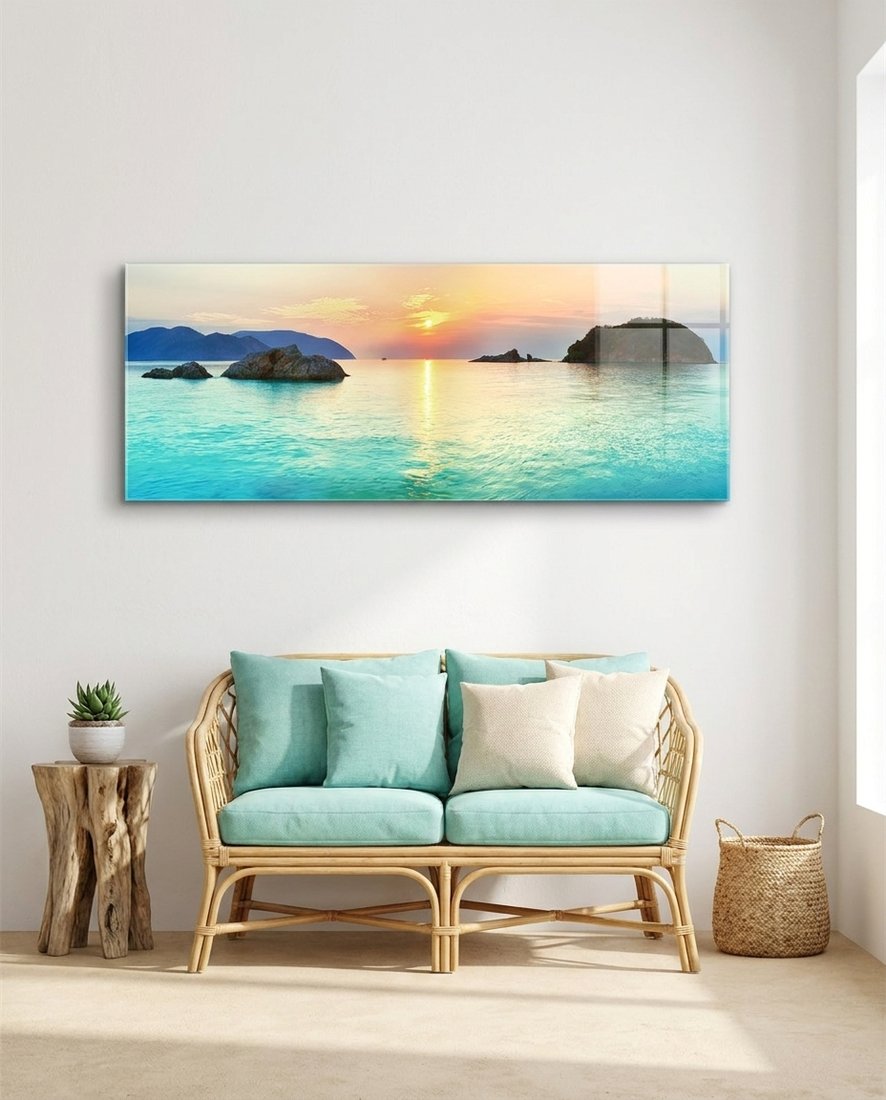 Turquoise bay islets at sunset panoramic glass wall art above a rattan loveseat with mint cushions
