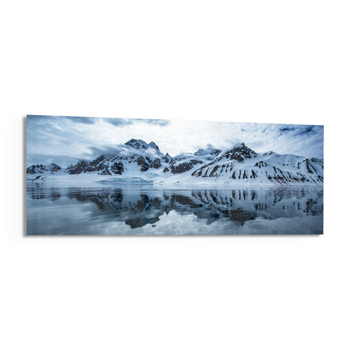 Snowy mountains icy lake panoramic glass wall art angled on a white background