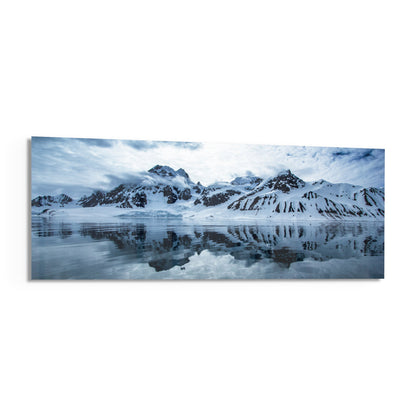 Snowy mountains icy lake panoramic glass wall art angled on a white background