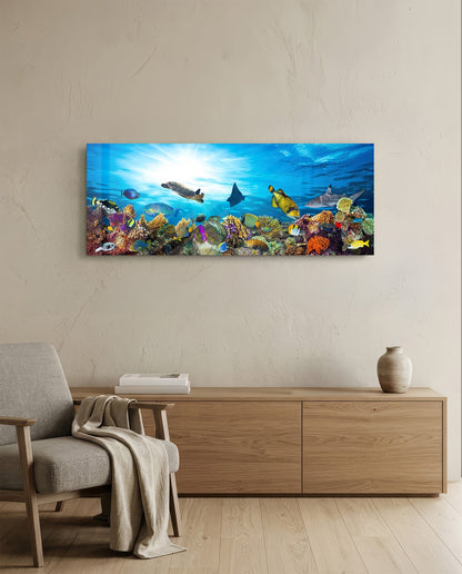 Coral reef sea turtle glass wall art above a light oak sideboard beside a cream armchair