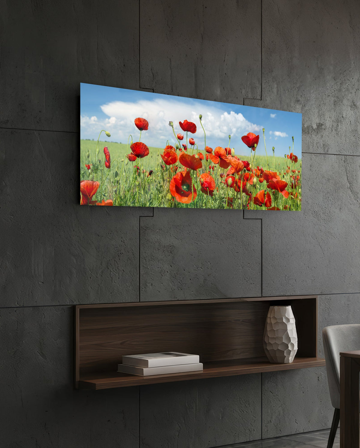 Red poppy field glass wall art on a dark slate wall above a walnut floating shelf