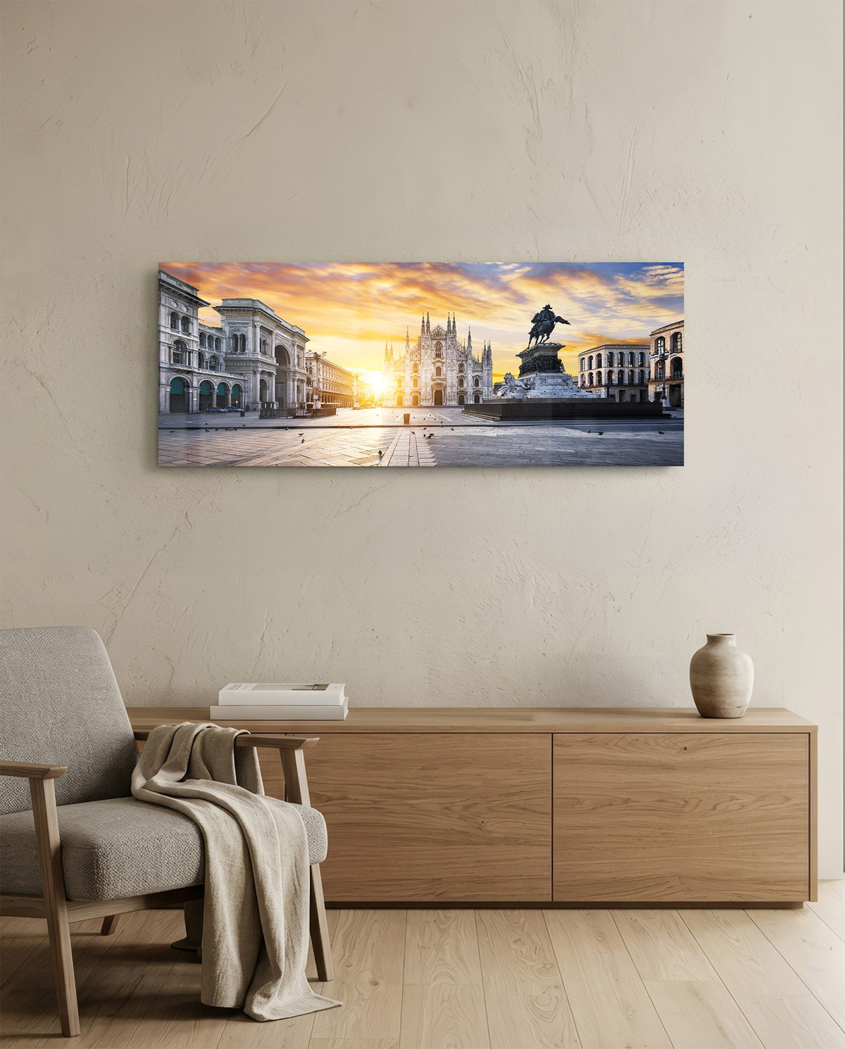 Cathedral square panoramic glass wall art above a wooden sideboard beside an armchair with a throw