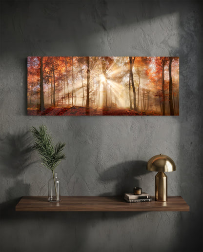 Autumn forest sun rays panoramic glass wall art above a wood shelf with a brass lamp on a dark wall