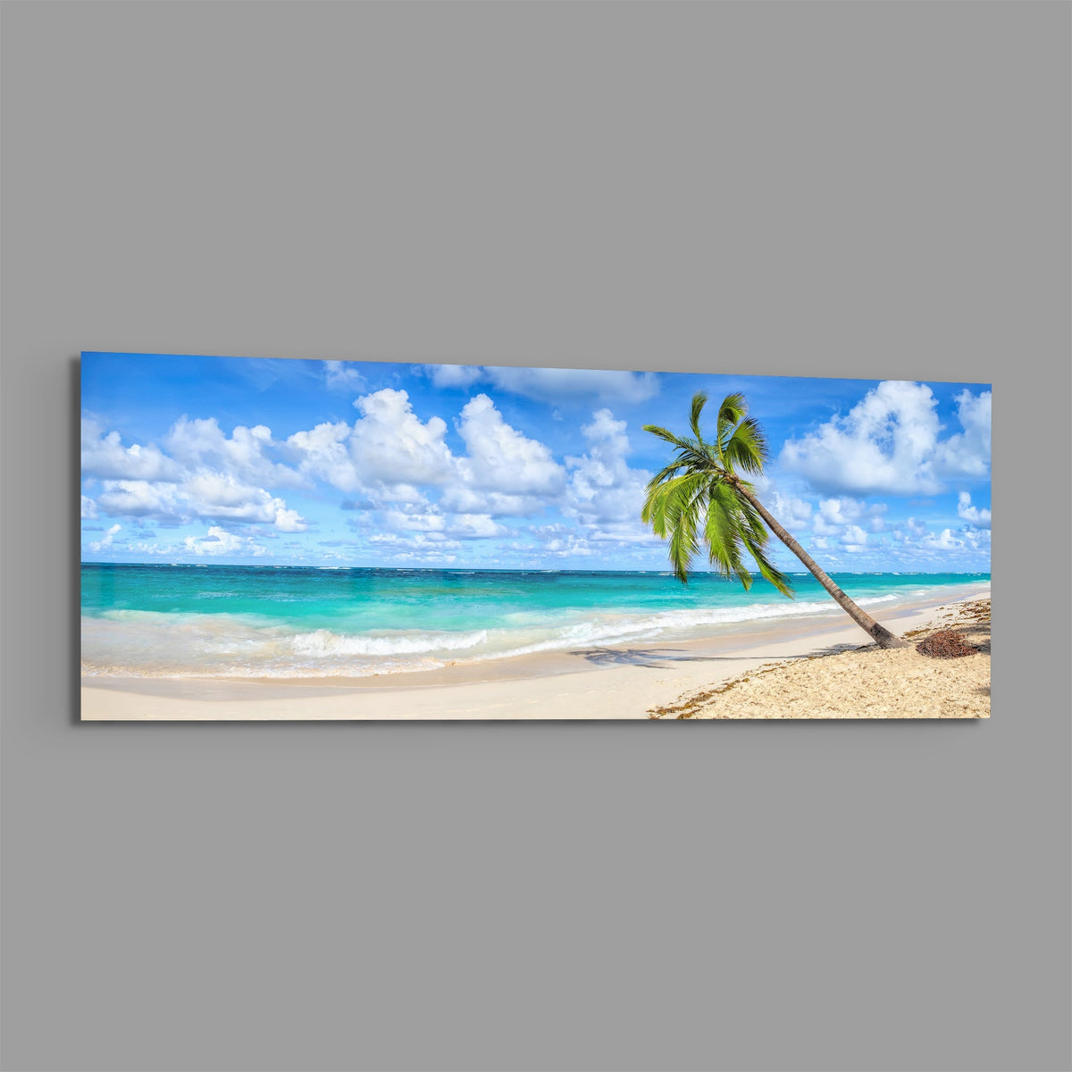 Tropical palm tree beach panoramic glass print angled on a gray background