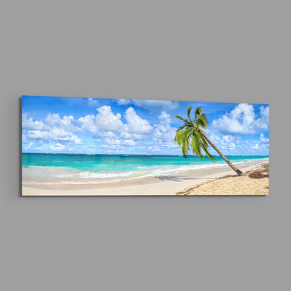 Tropical palm tree beach panoramic glass print angled on a gray background
