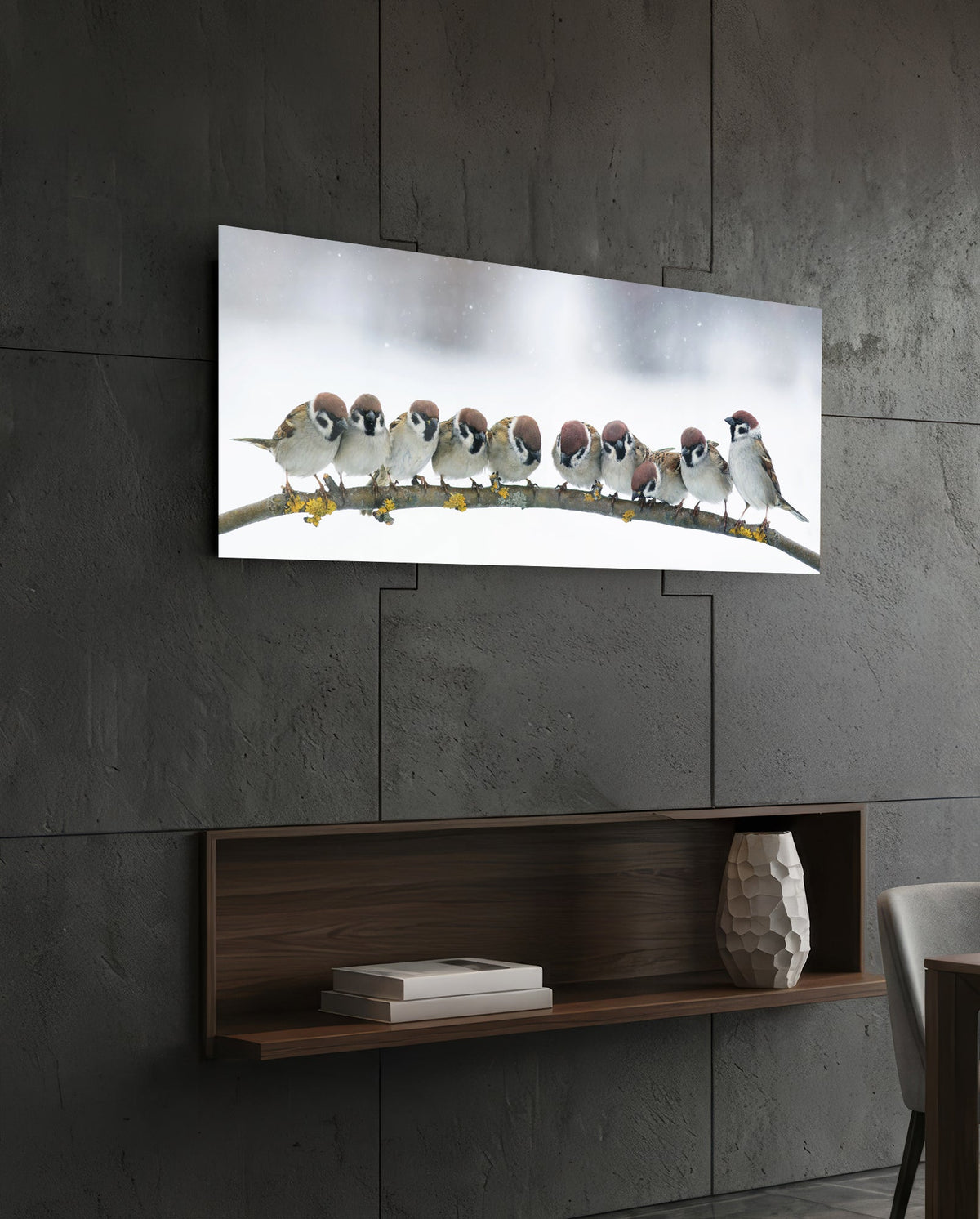Snowy sparrows glass wall art on a dark tiled wall above an open walnut shelf