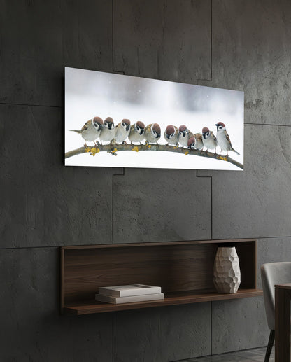Snowy sparrows glass wall art on a dark tiled wall above an open walnut shelf