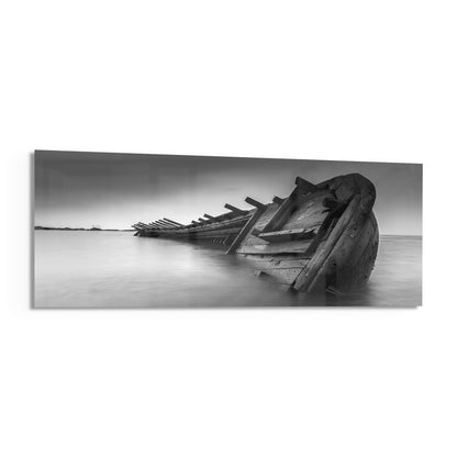Black and white shipwreck panoramic glass print angled on a white background