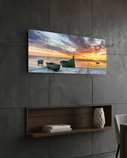 Fishing boats at sunset beach glass wall art above a dark wood wall shelf on a charcoal paneled wall