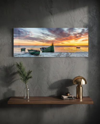 Fishing boats at sunset beach glass wall art above a floating walnut shelf with a brass lamp