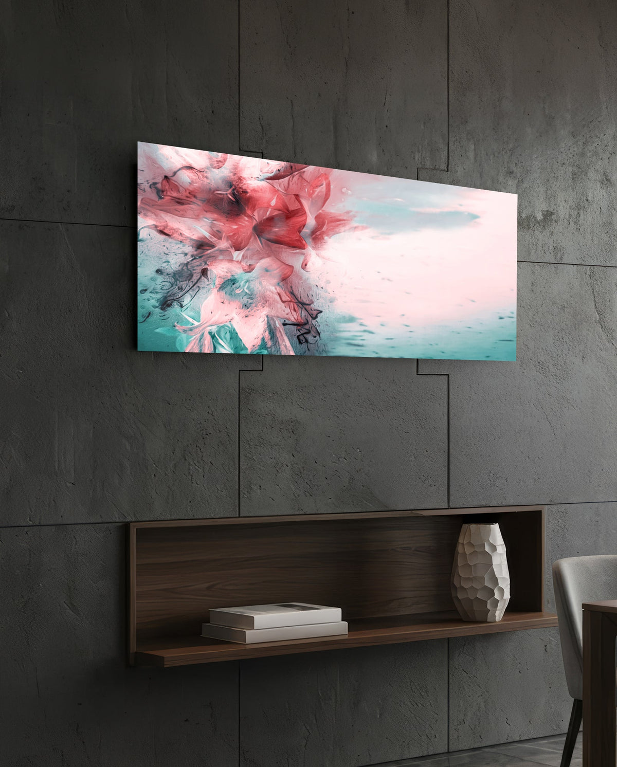 Coral and teal ink burst abstract glass wall art above a dark wood wall shelf on a charcoal paneled wall