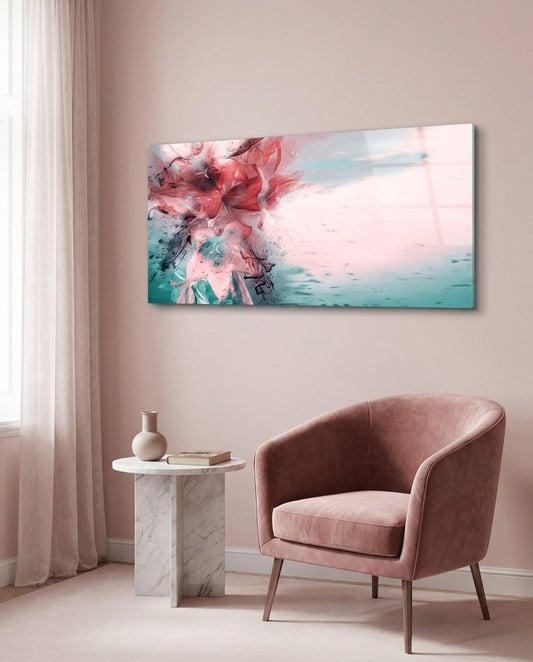 Coral and teal ink burst abstract panoramic glass wall art beside a pink velvet armchair in a blush pink room