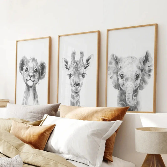 Black and white jungle nursery wall art set of 3 with lion, giraffe, and elephant