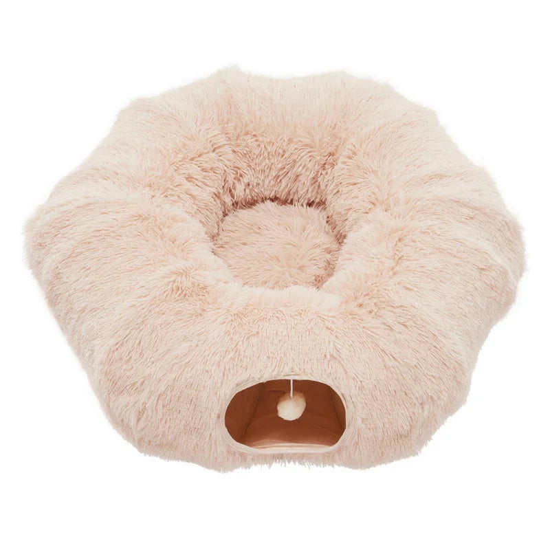 Beige donut-shaped plush cat cave tunnel with soft interior and hanging ball toy