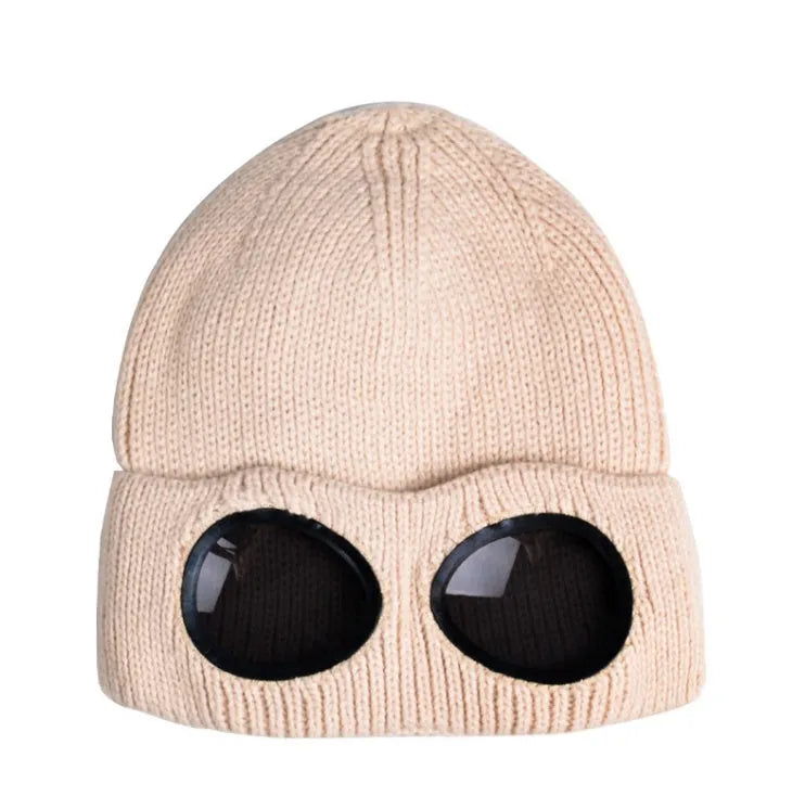 Beige knitted wool beanie with goggle lenses, front view