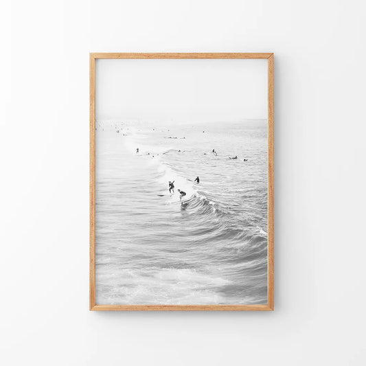 Black and white surfers on the waves coastal wall art print
