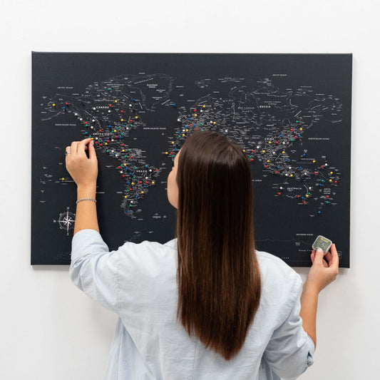 Black world map canvas wall art in a pine wood frame