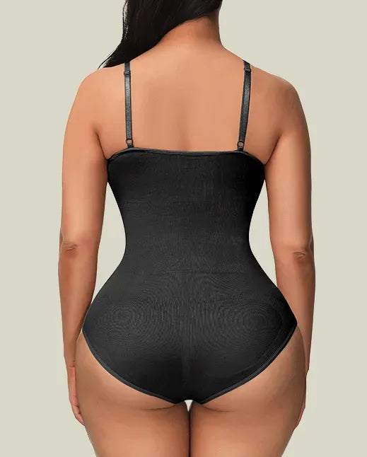 Black bodysuit shapewear brief back worn by a model on a neutral background