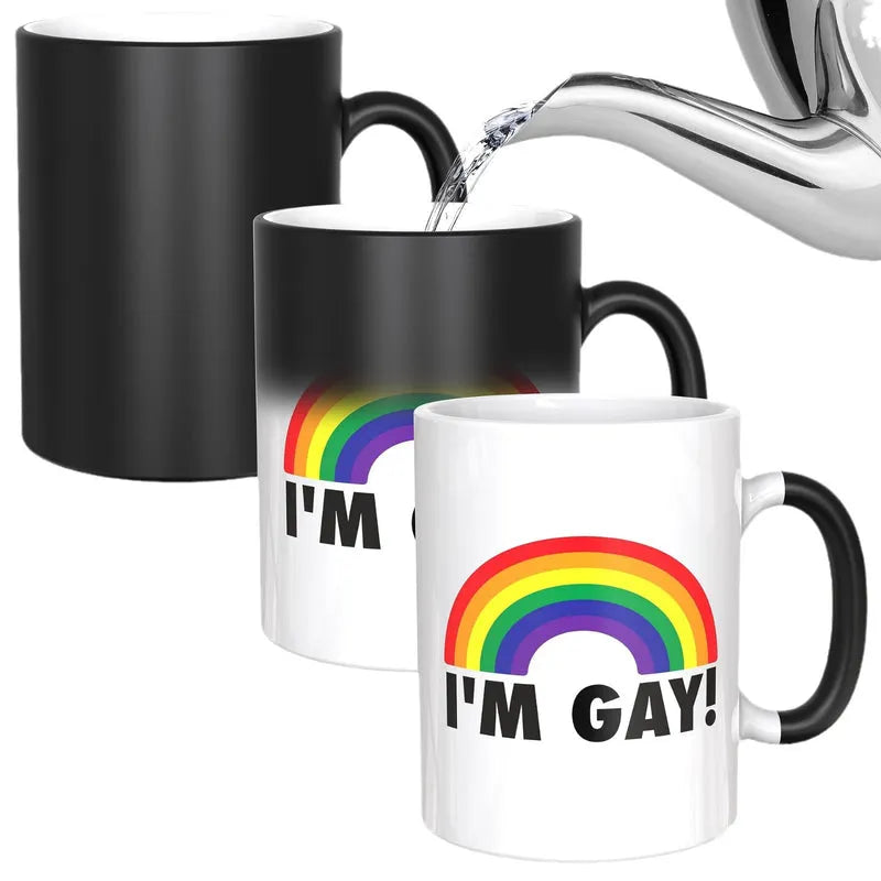 Black color-changing mug transforming to white with rainbow “I’M GAY!” when hot water is poured