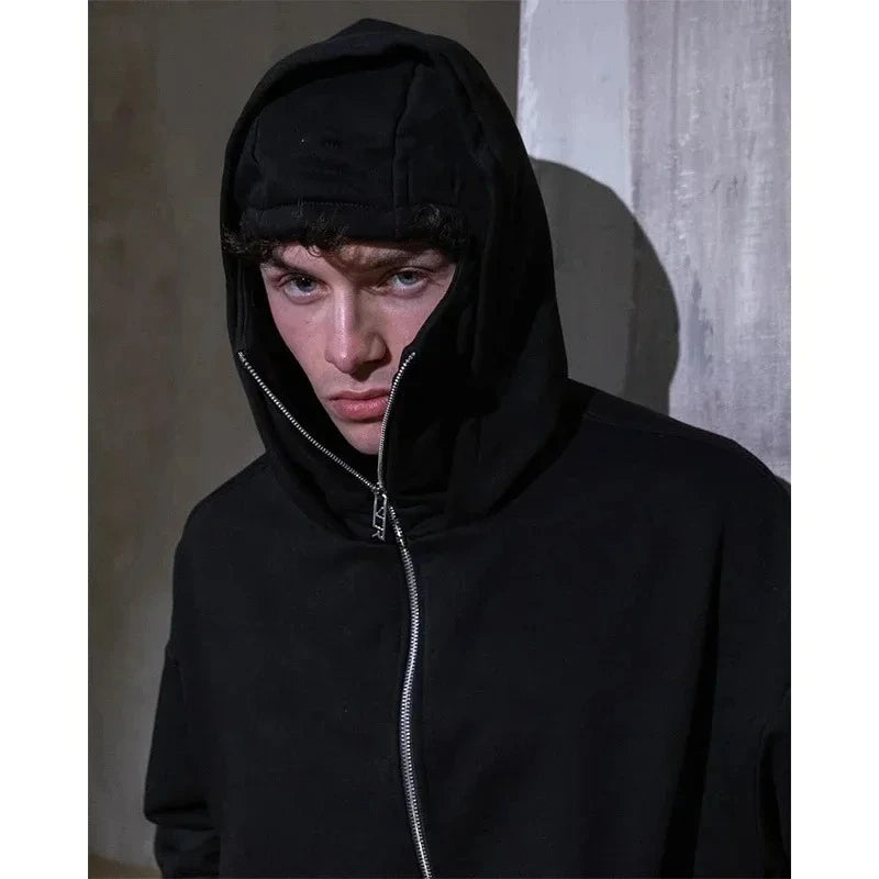 Black face mask hoodie zip up worn by model urban streetwear