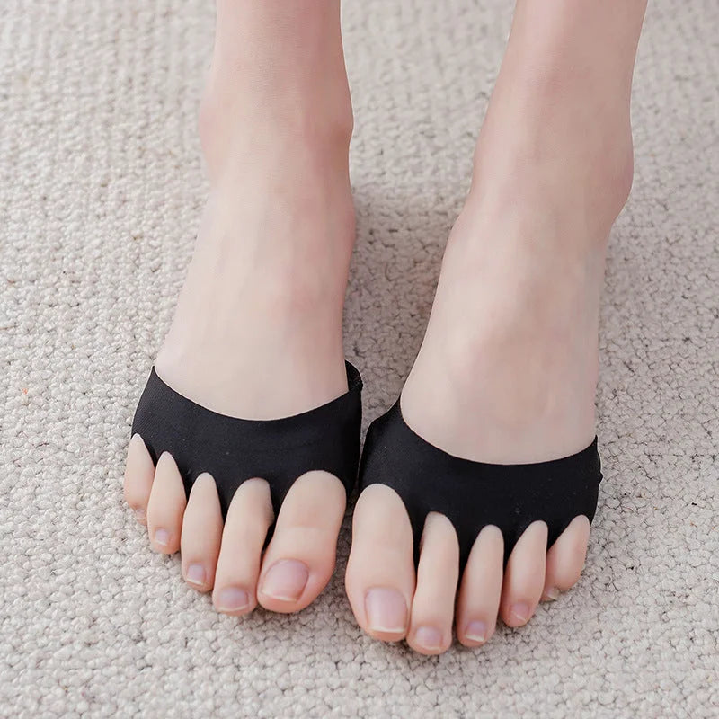 Black forefoot pad socks with toe slots worn on feet for pain relief and heel cushioning
