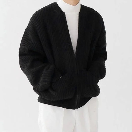 Black men’s chunky knit cardigan shown in a minimal white outfit
