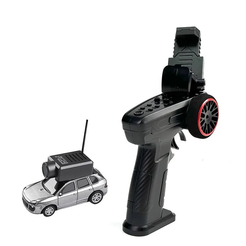 Black remote control with a controlled mini RC car with camera