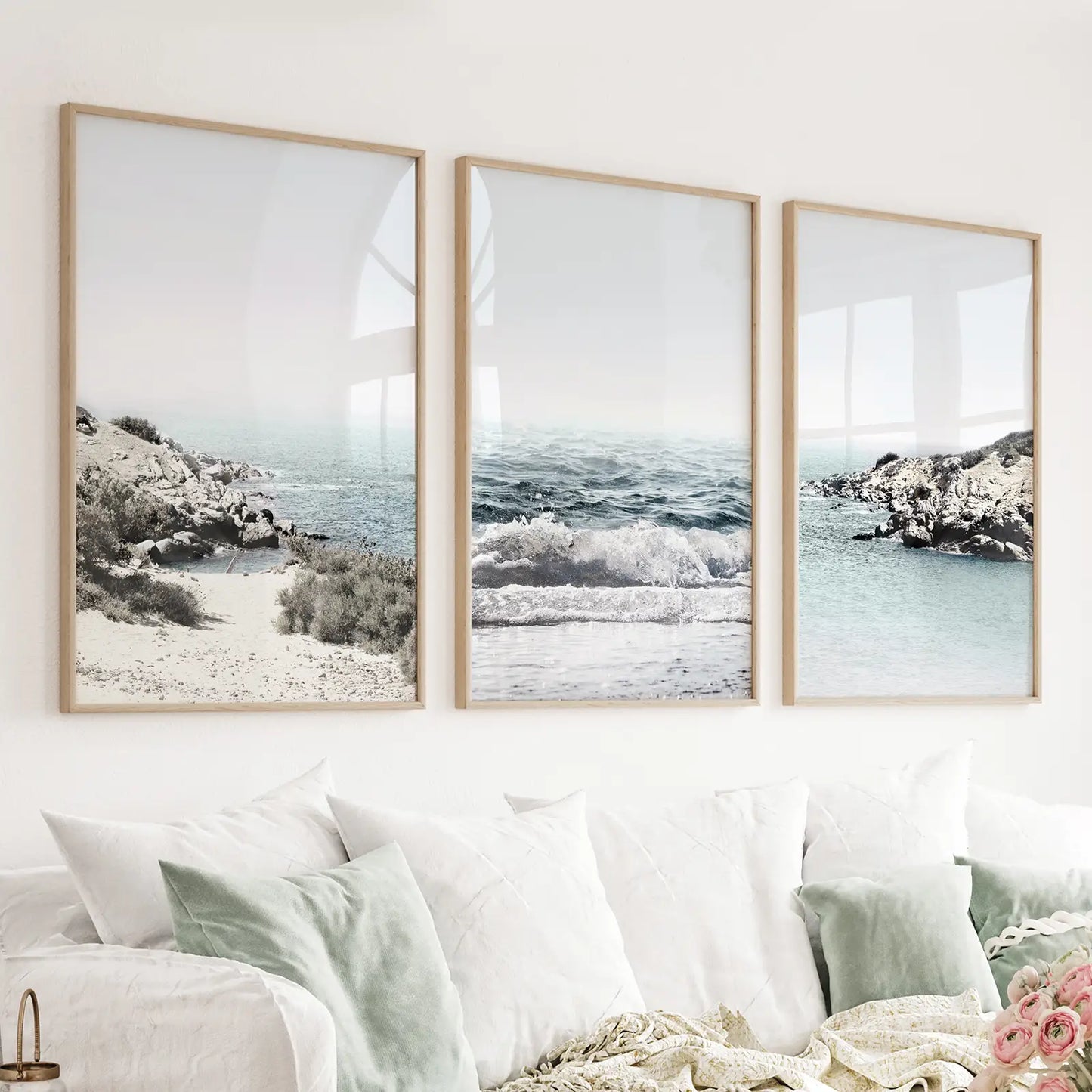 Set of 3 pastel blue coastal seascape prints with waves and a rocky beach