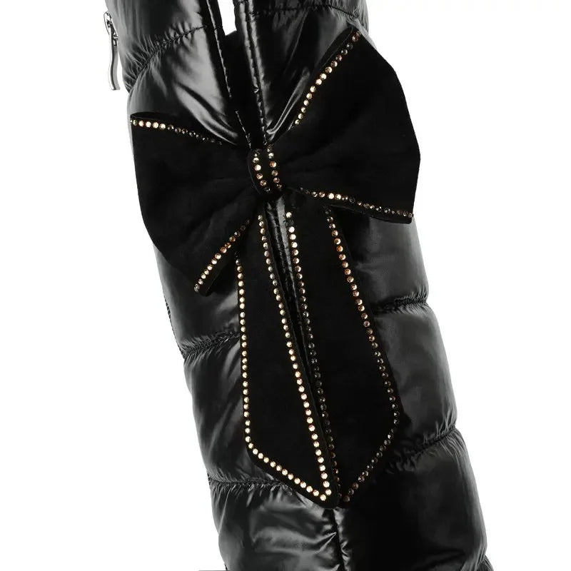 Bow patchwork detail with gold buckle accent on over the knee snow boots