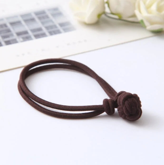 Brown hair tie elastic band with decorative knot ball stretchy fabric hair accessory