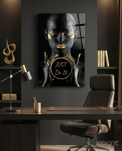 Just Do It gold glass wall art, woman holding a gold disk reading Just Do It on black