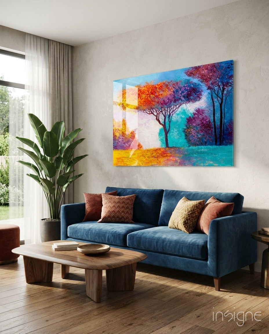 Autumn Pines glass wall art hanging in a living room